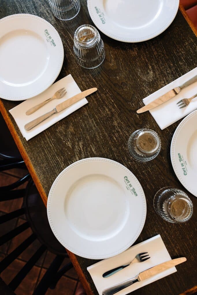 The plates and a set table.