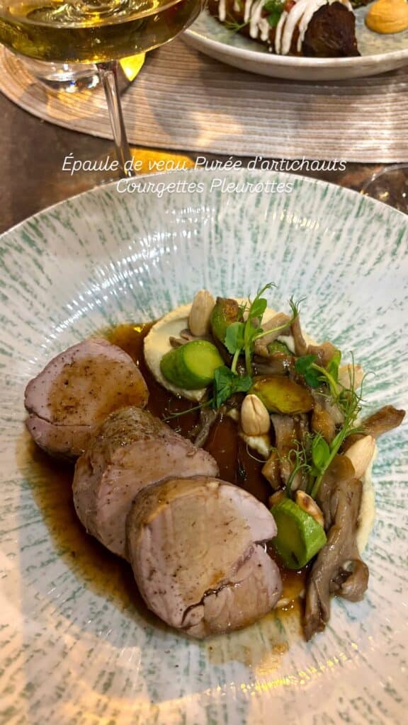 A veal shoulder with artichoke puree courgettes oyster mushrooms.