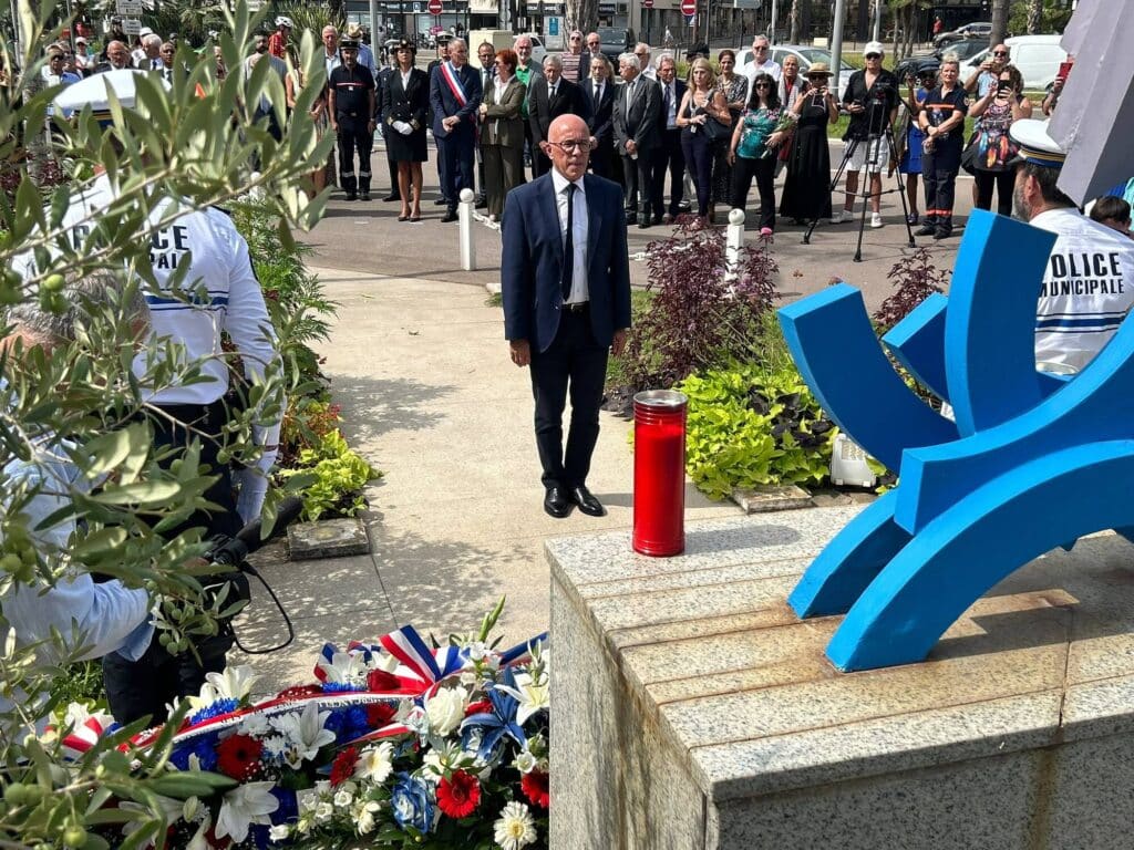 Eric Ciotti standing in front of the memorial stone for the commemoration of the Caravelle crash Ajaccio-Nice