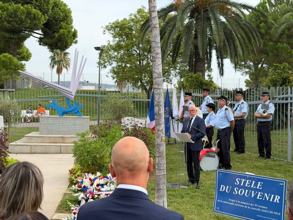 Éric Ciotti standing behind the podium giving a speech during the 58th commemoration of the Caravelle crash Ajaccio-Nice