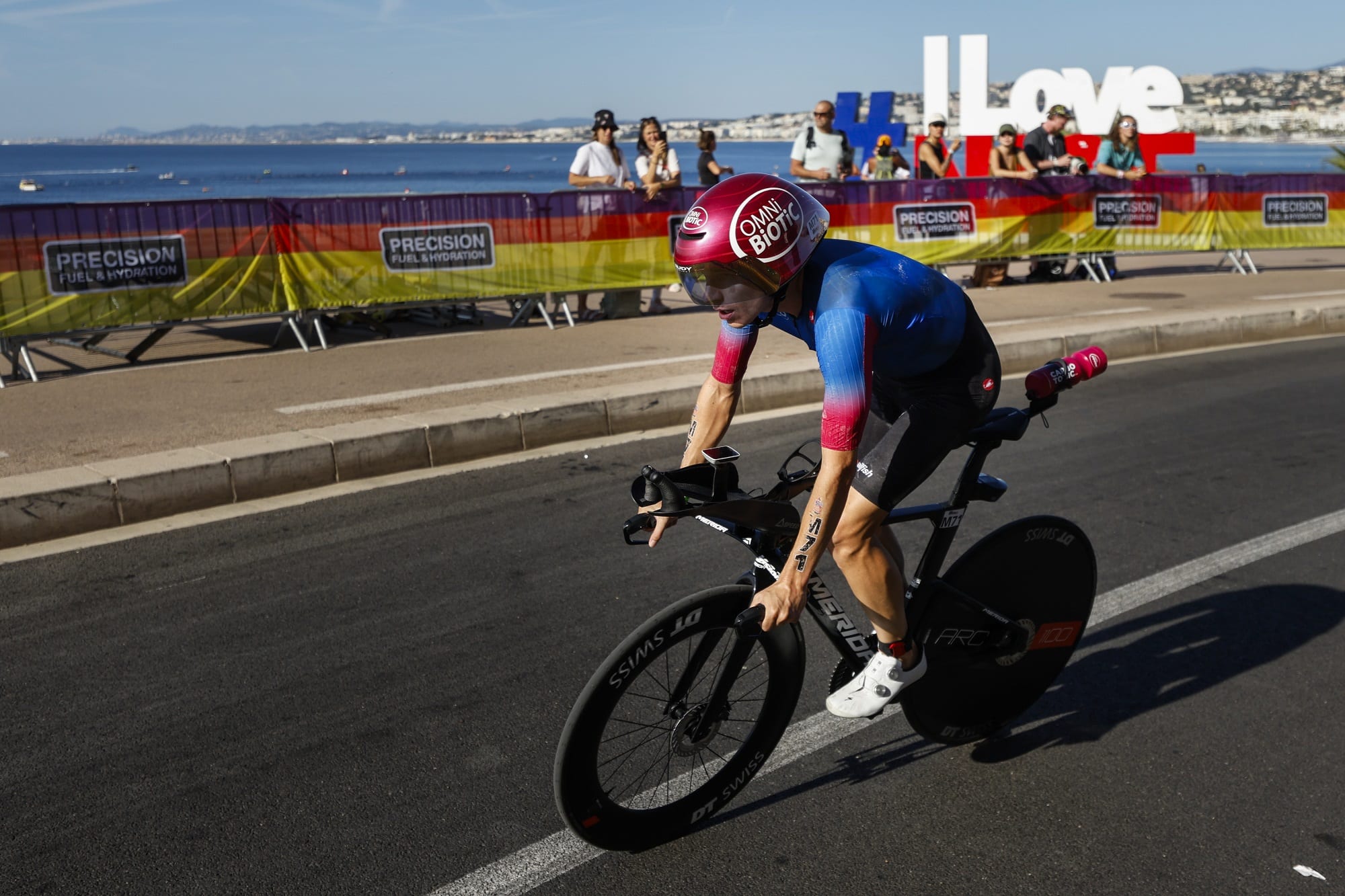 A British cyclist gets off his bike.