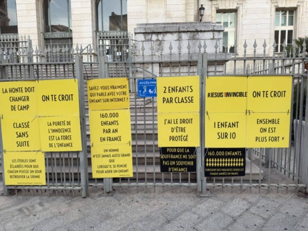Signs hung on the fences of the Nice Courthouse to denounce and raise awareness about child abuse.