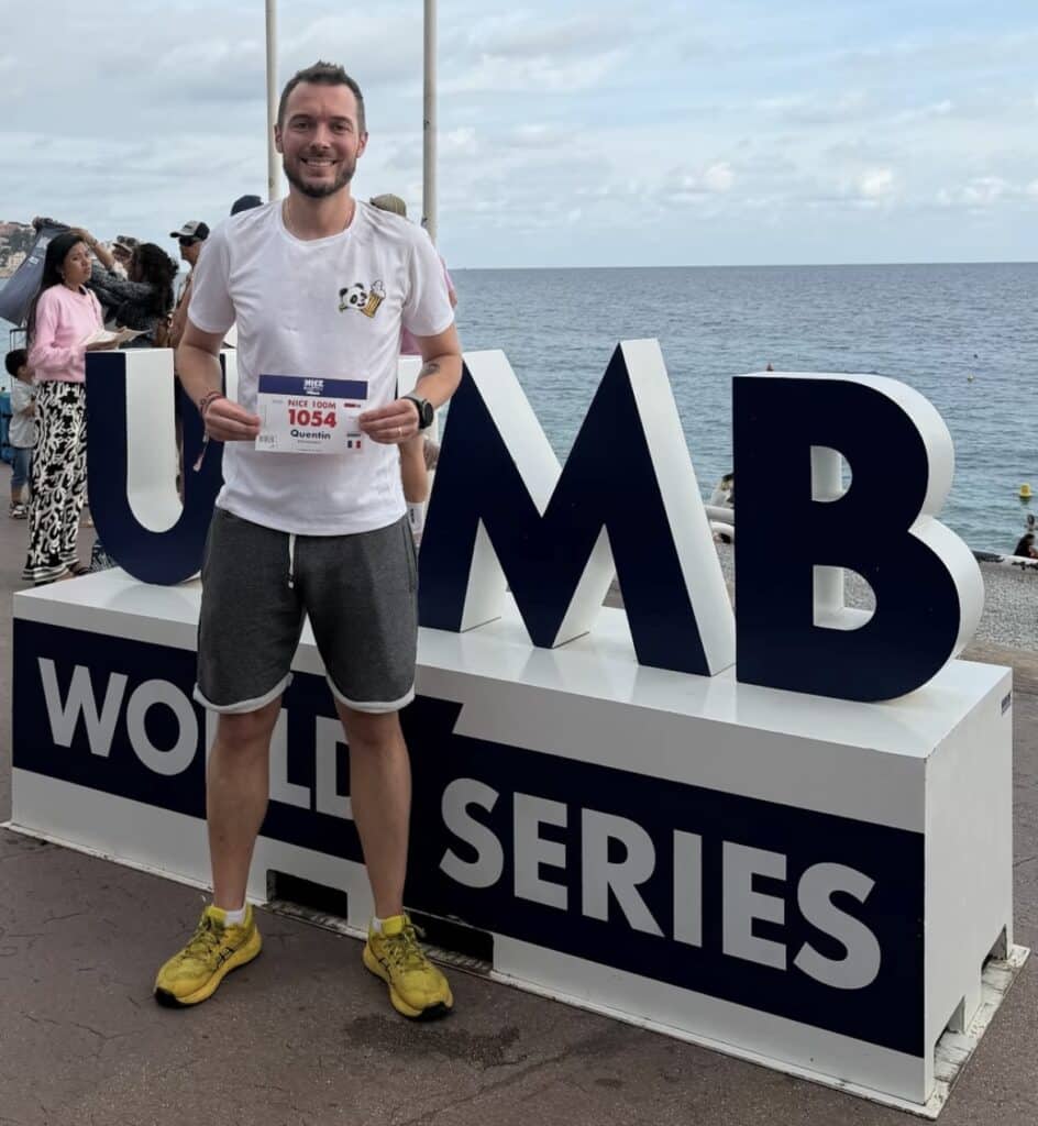Quentin Brondeault with his race bib in Nice in front of the sea