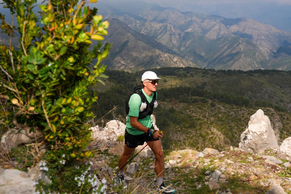 An athlete walks in the mountain.