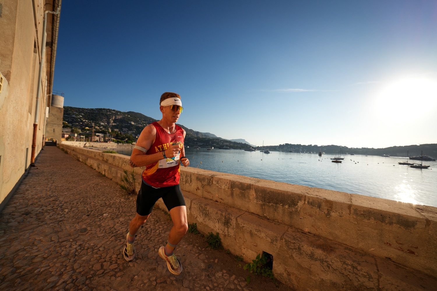 A man runs on the Promenade des Anglais.