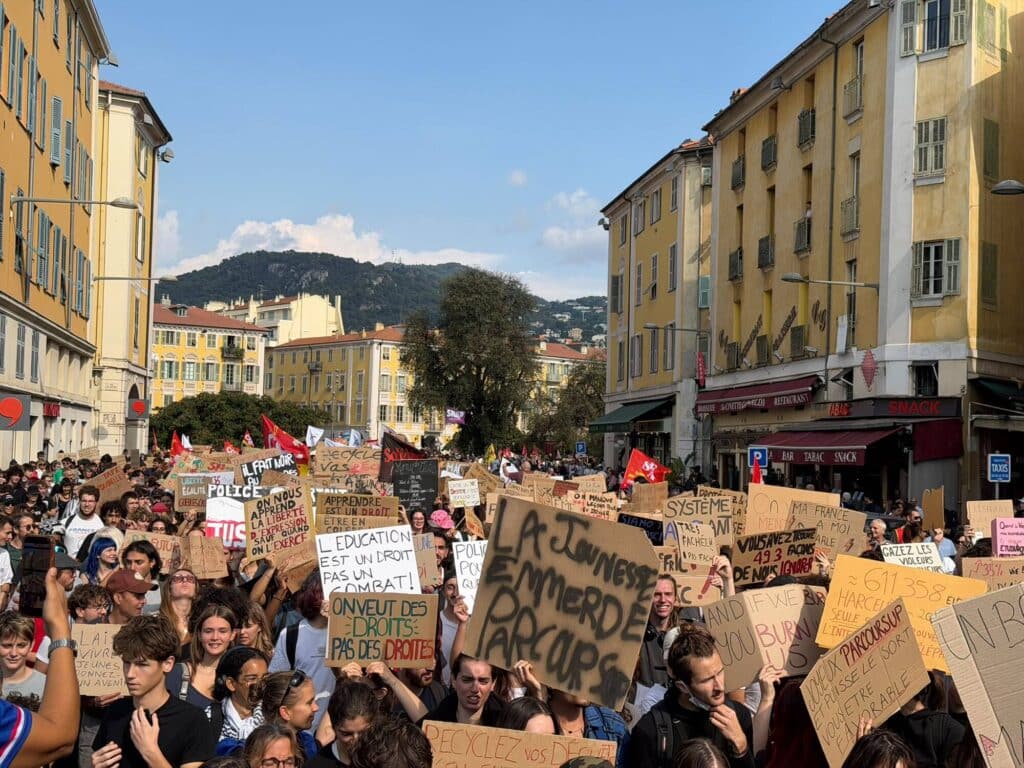 Students brandishing signs made for the occasion
