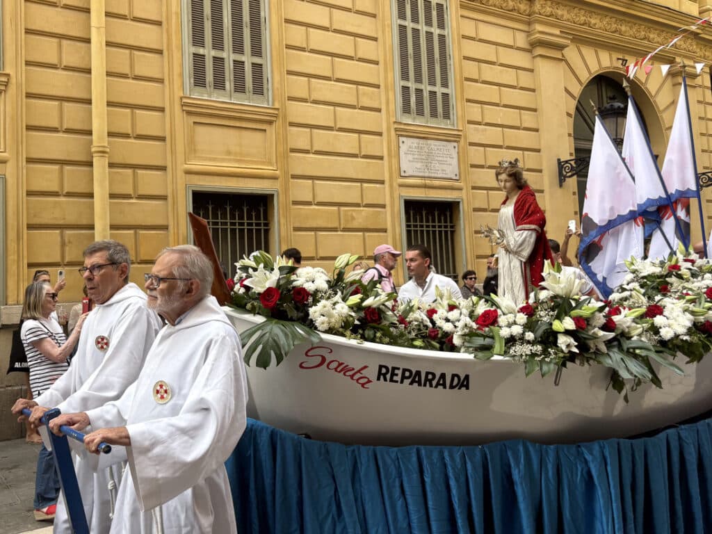 The flower-decorated boat named after the Patron Saint of Nice is at the heart of the procession.
